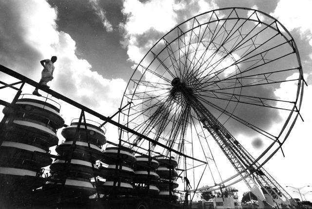 The giant Ferris wheel comes down at the fair in 1988.